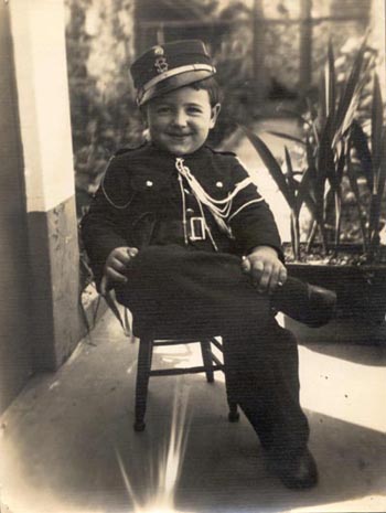 Luis dressed in a policeman  costume at Carnival time